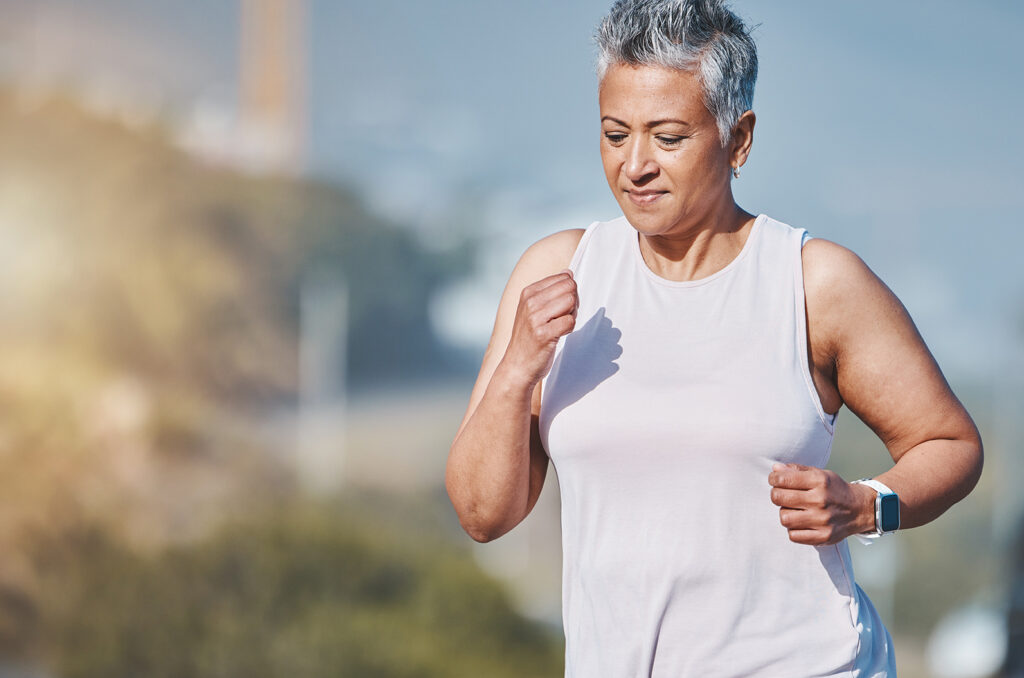 Senior woman, fitness running and outdoor exercise for sports wellness, healthy body workout and cardio training. Elderly athlete, focus and runner freedom and marathon lifestyle in nature park